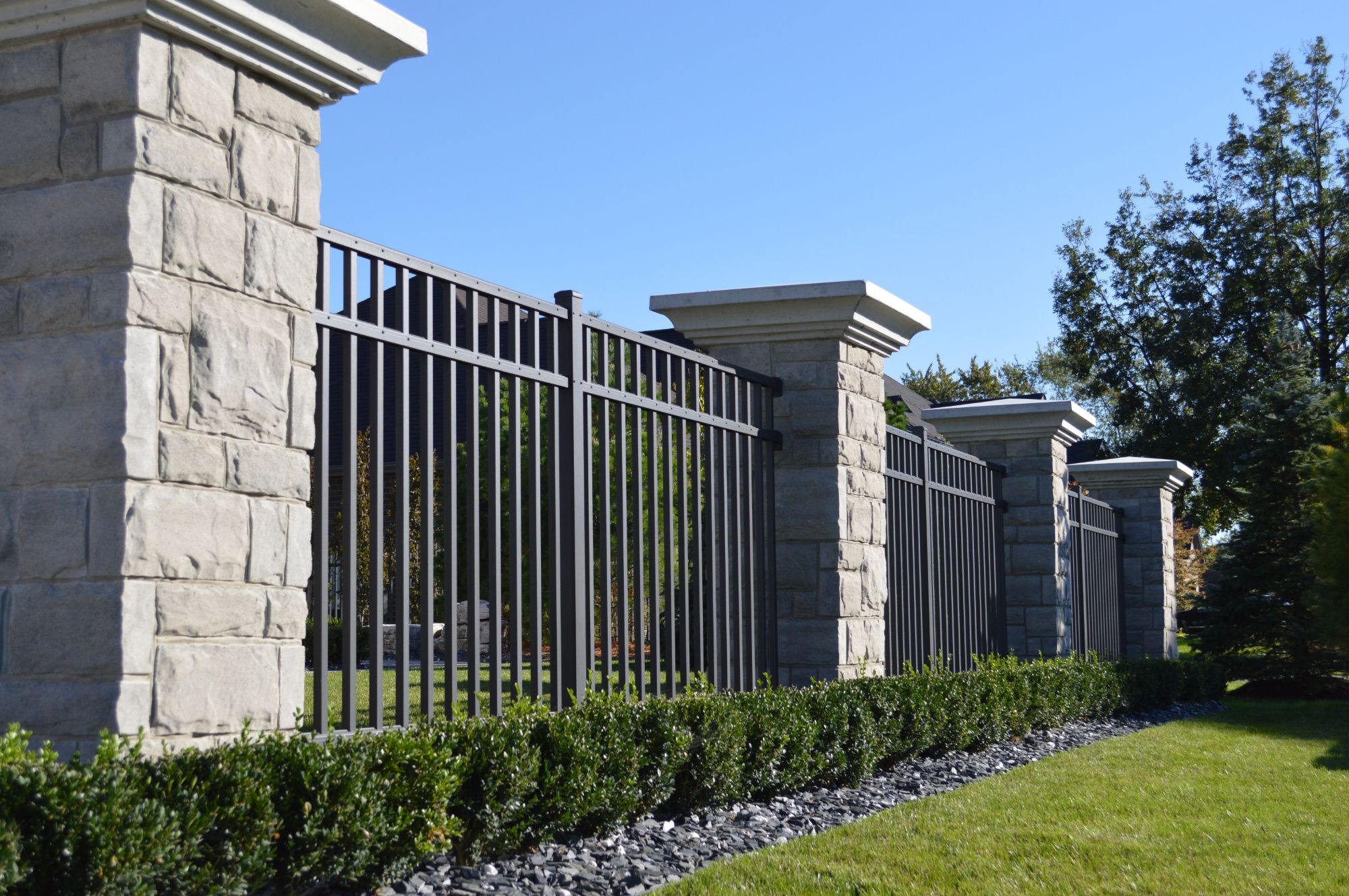 Industrial Aluminum fence between stone pillar - Matte Bronze 