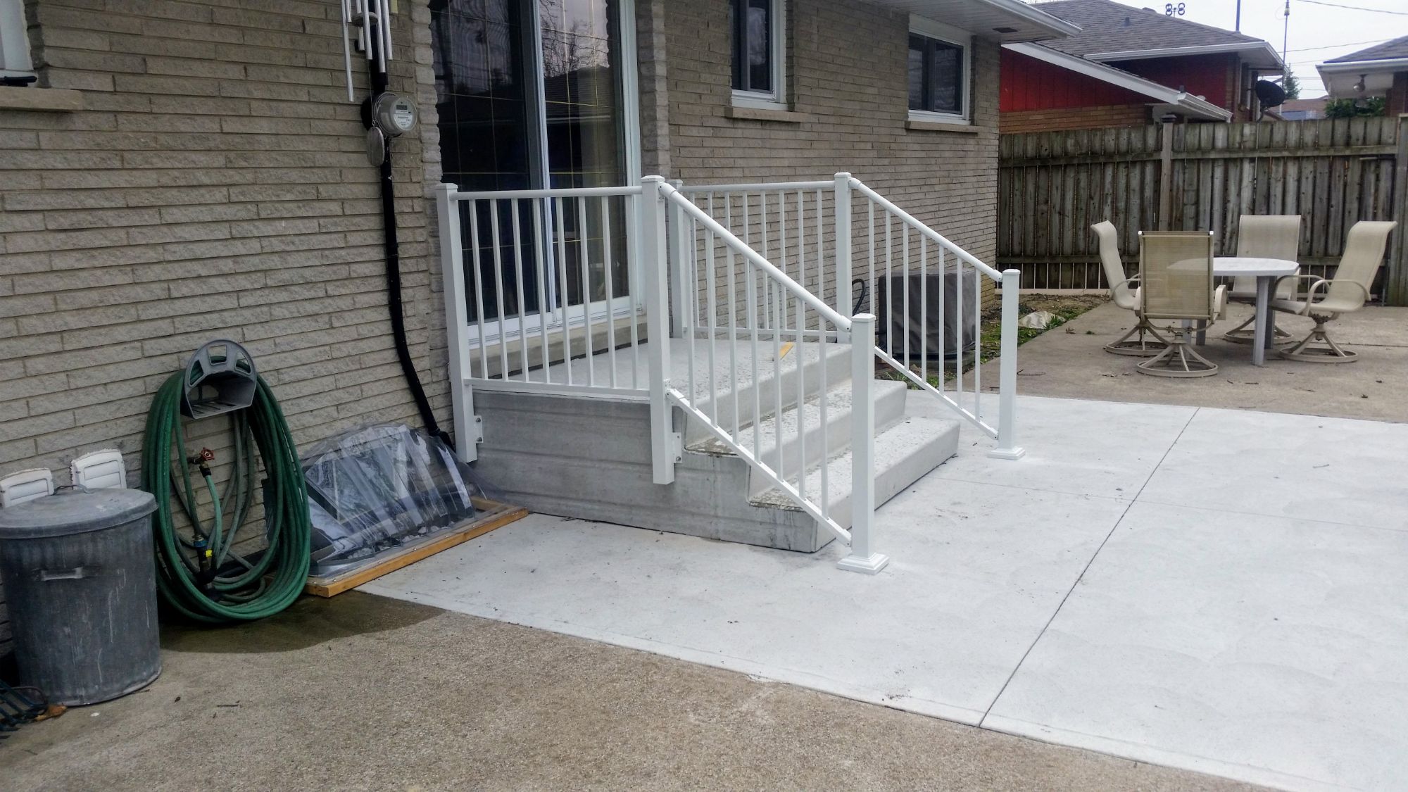 Back in 2018, we did this porch rail for a customer in central Windsor. Side-mounted to a precast concrete steps - it is secure while maintaining maximum walking room. Powder-coated white, this porch railing will last this customer for years to come.