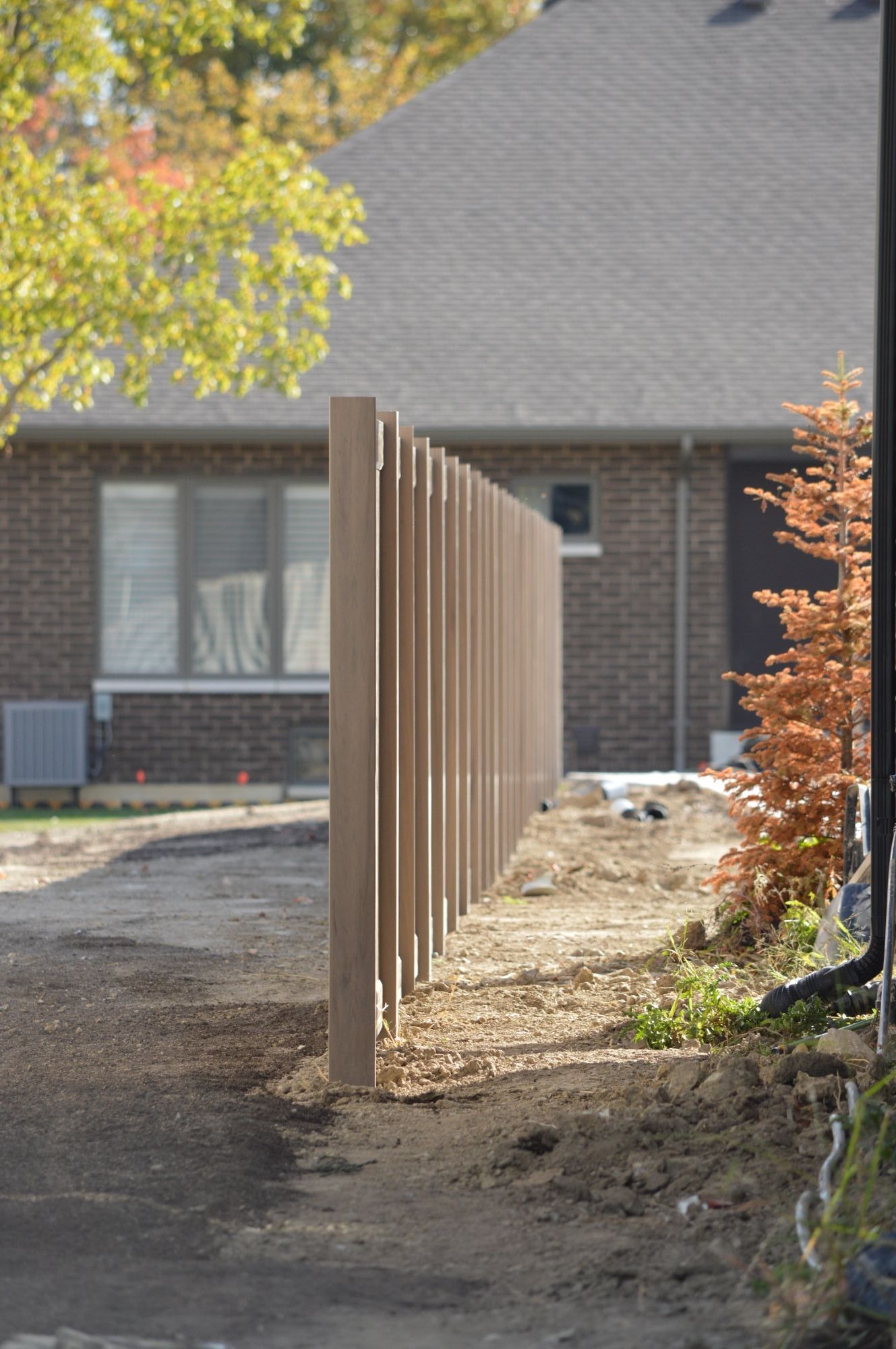 Straight as an arrow, we set these PVC fence posts in Lasalle perfectly in line. Backing onto some Town homes, the Green Teak fence was a great choice to combine the various styles of the neighborhood. We ended up doing close to 600ft and a total of 5 different properties with this.