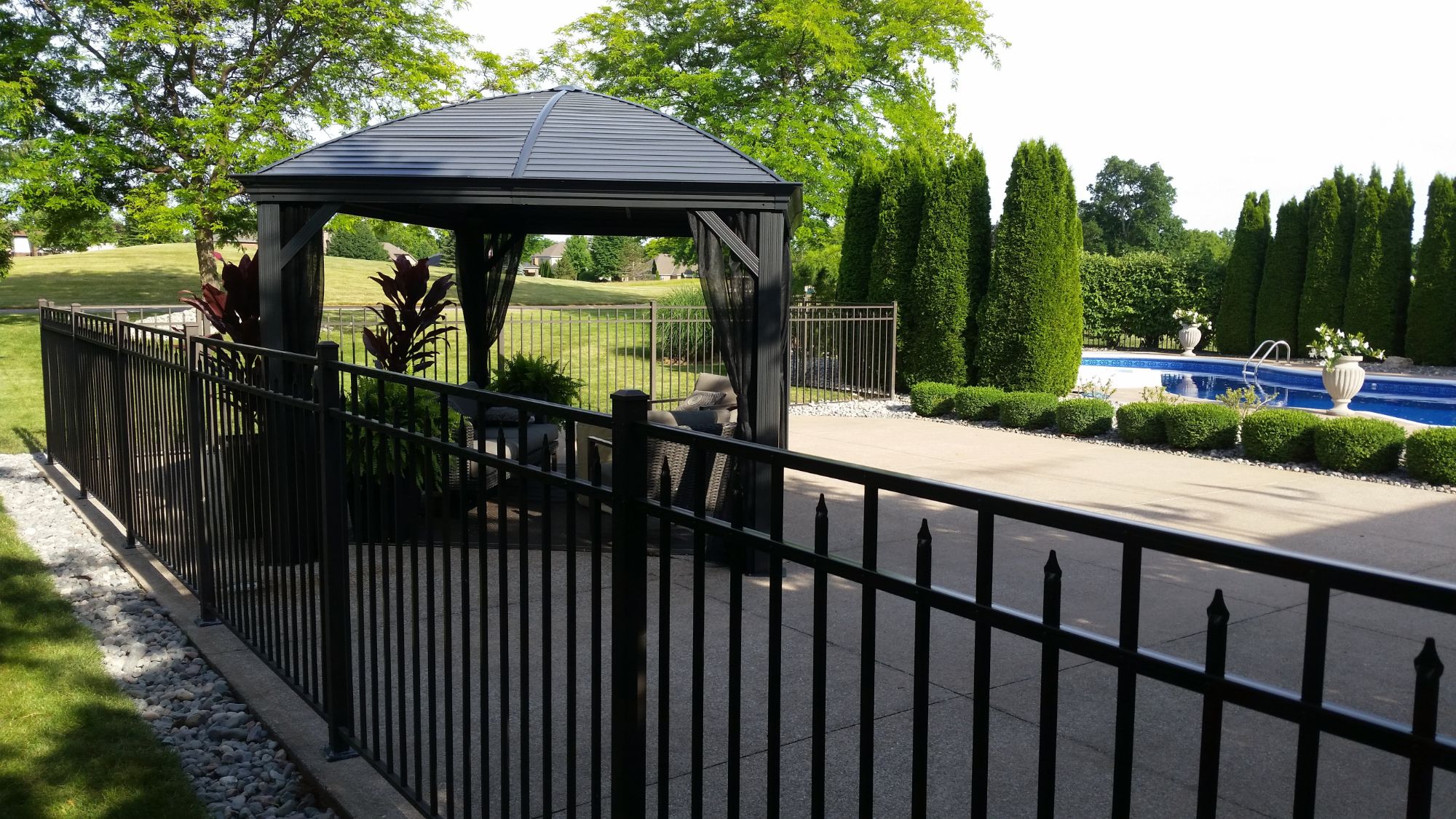 Royal Aluminum Fence that we expanded to turn this basketball court into part of the entertaining area in the back yard near Point west Golf Course.